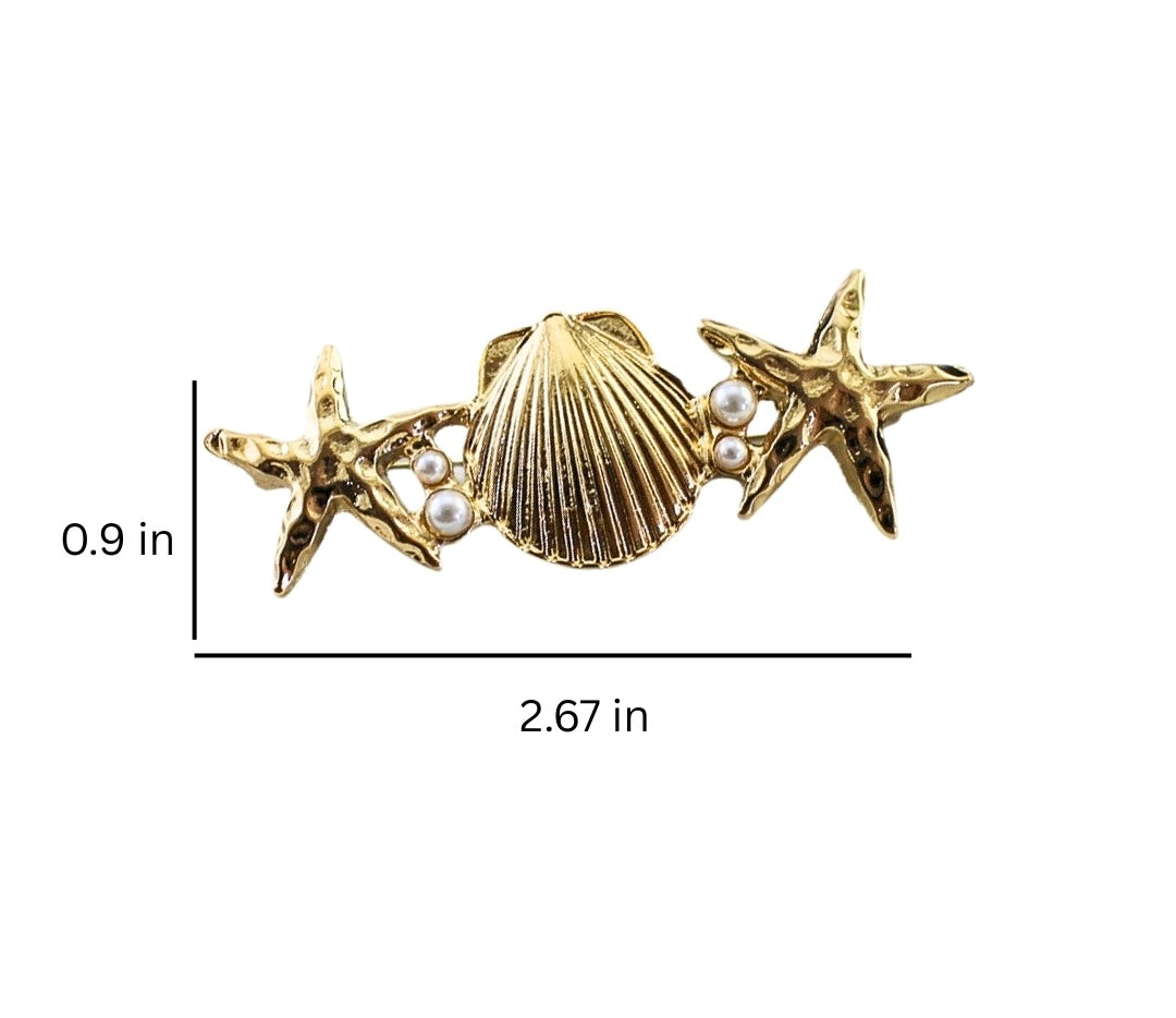 Star and shell metal brooch