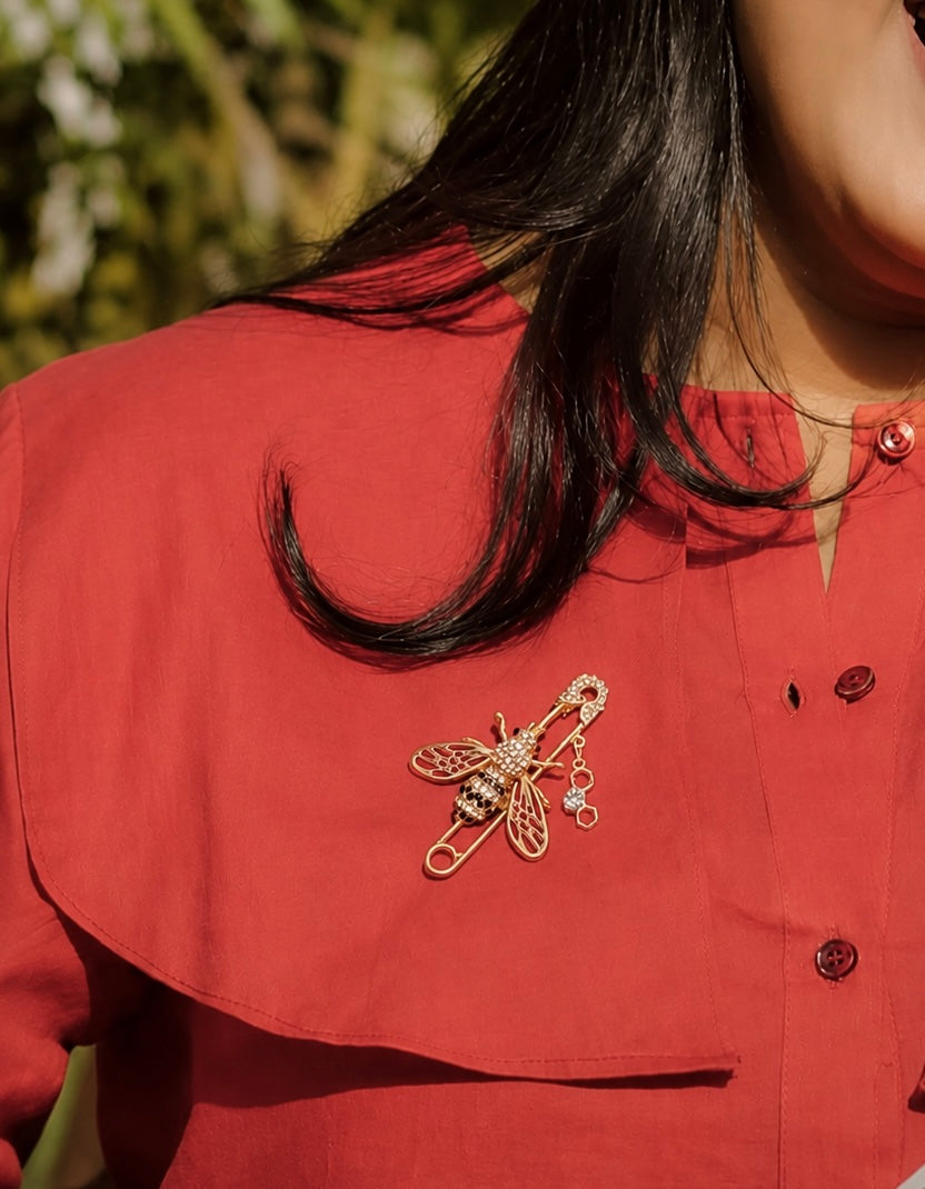 Golden and red bee pin