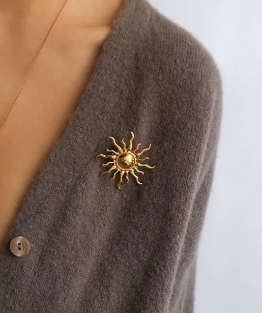 Metal sun brooch
