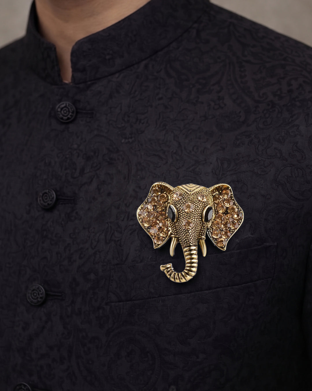 Golden elephant face brooch