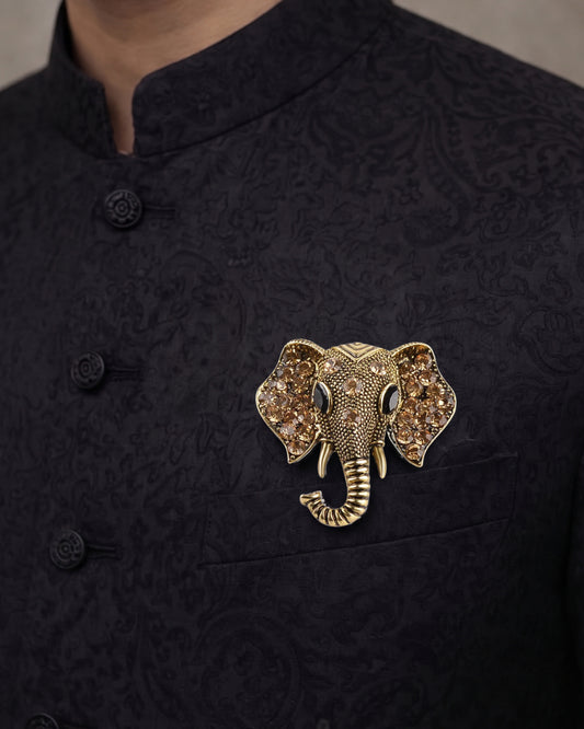 Golden elephant face brooch