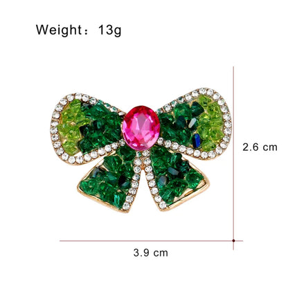 Emerald kiss bow brooch