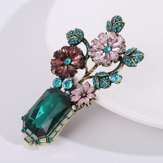 Majestic flower vase brooch