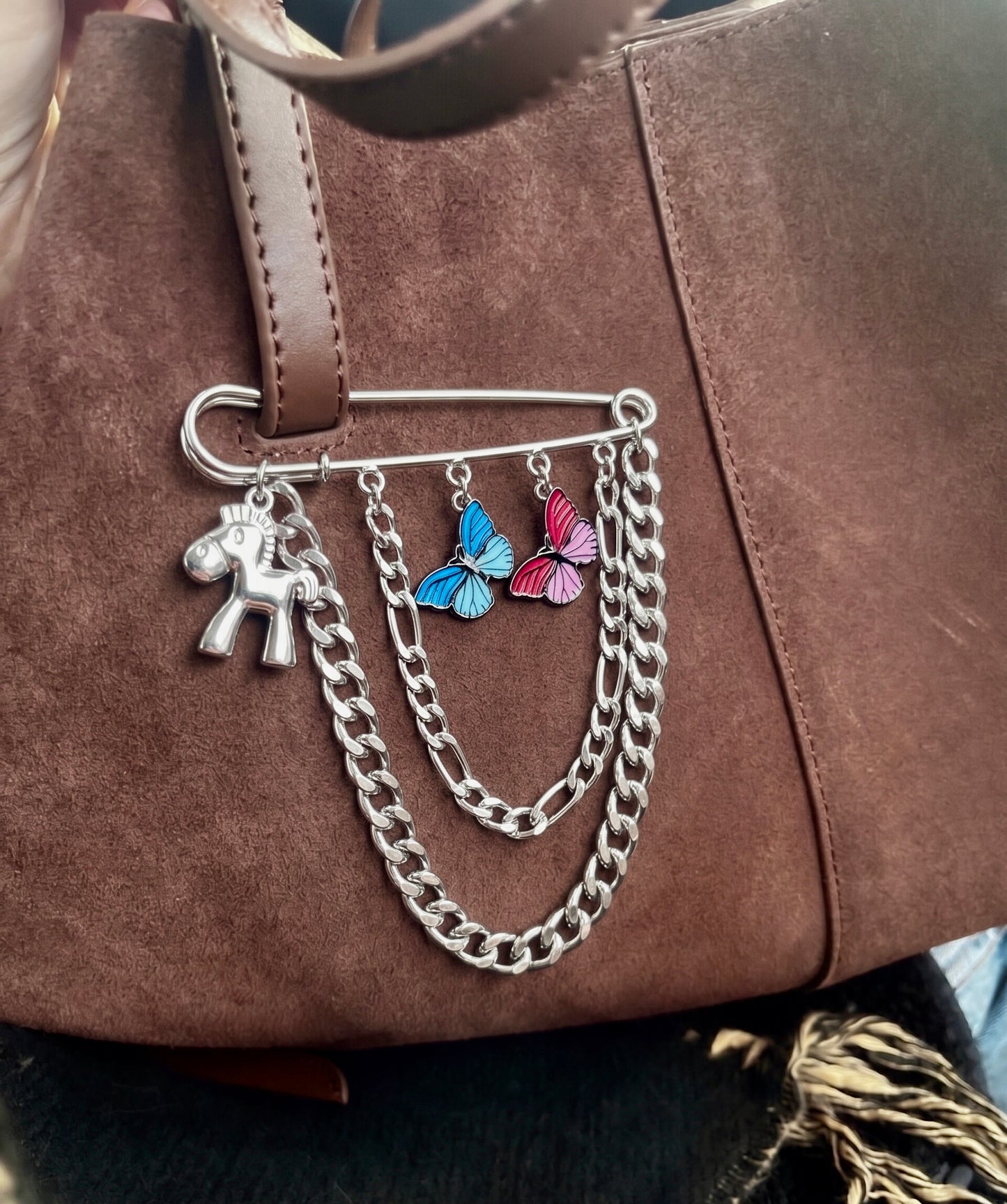 Silver flutter charm bag pin